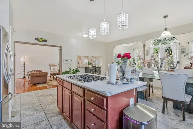 a view of kitchen island dining table and chairs