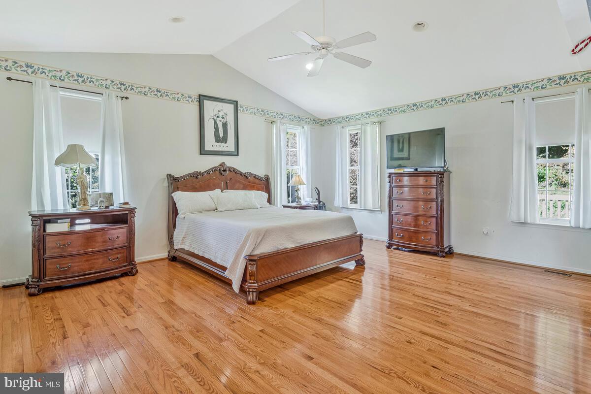 215 Hoile Lane Huntingtown, MD 20639 - Photo 23 of 52 a bedroom with a bed and a dresser