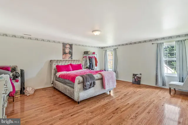 a bedroom with a bed and a room