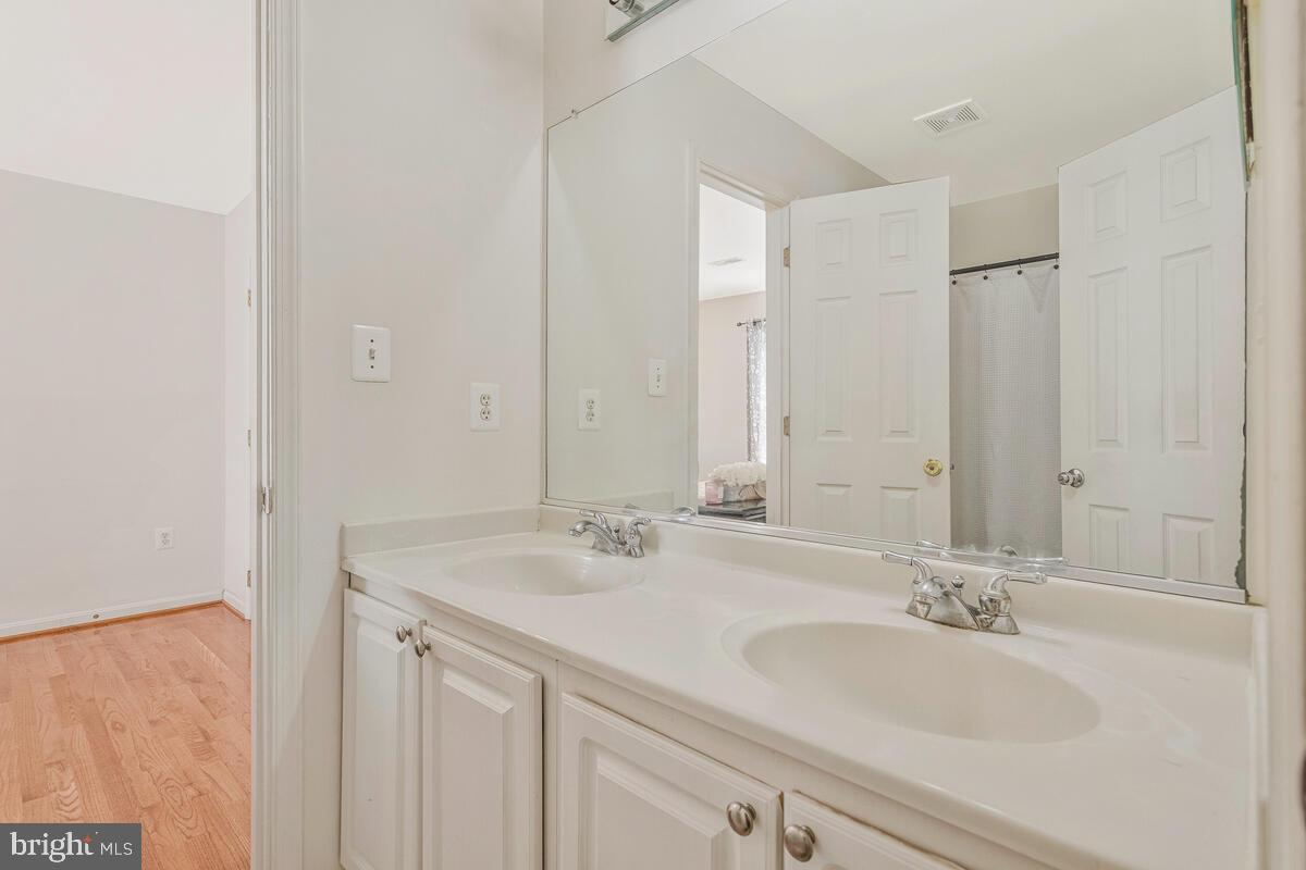 215 Hoile Lane Huntingtown, MD 20639 - Photo 34 of 52 a bathroom with a sink and a mirror