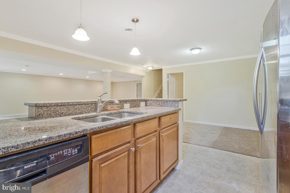215 Hoile Lane Huntingtown, MD 20639 - Photo 40 of 52 a bathroom with a granite countertop sink and a mirror