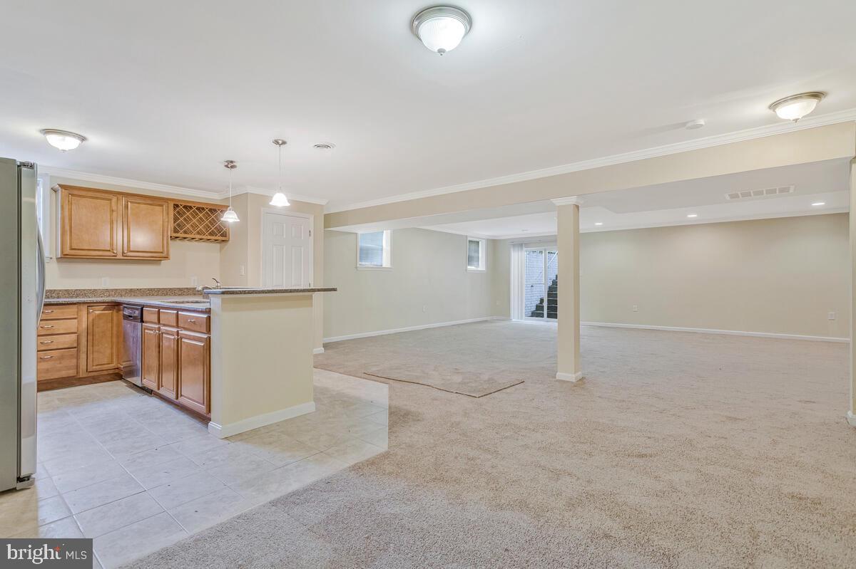 215 Hoile Lane Huntingtown, MD 20639 - Photo 41 of 52 a view of a kitchen with a sink and cabinets