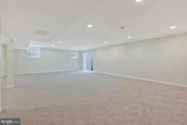 a room with a flowers and a mirror