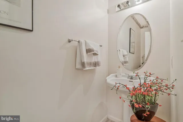 a bathroom with a double vanity sink mirror and