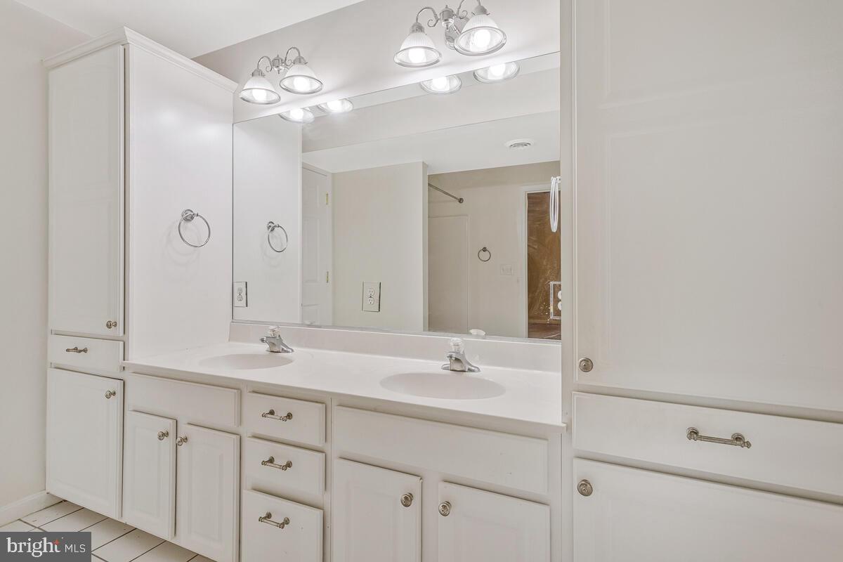 215 Hoile Lane Huntingtown, MD 20639 - Photo 48 of 52 a bathroom with a double vanity sink mirror and