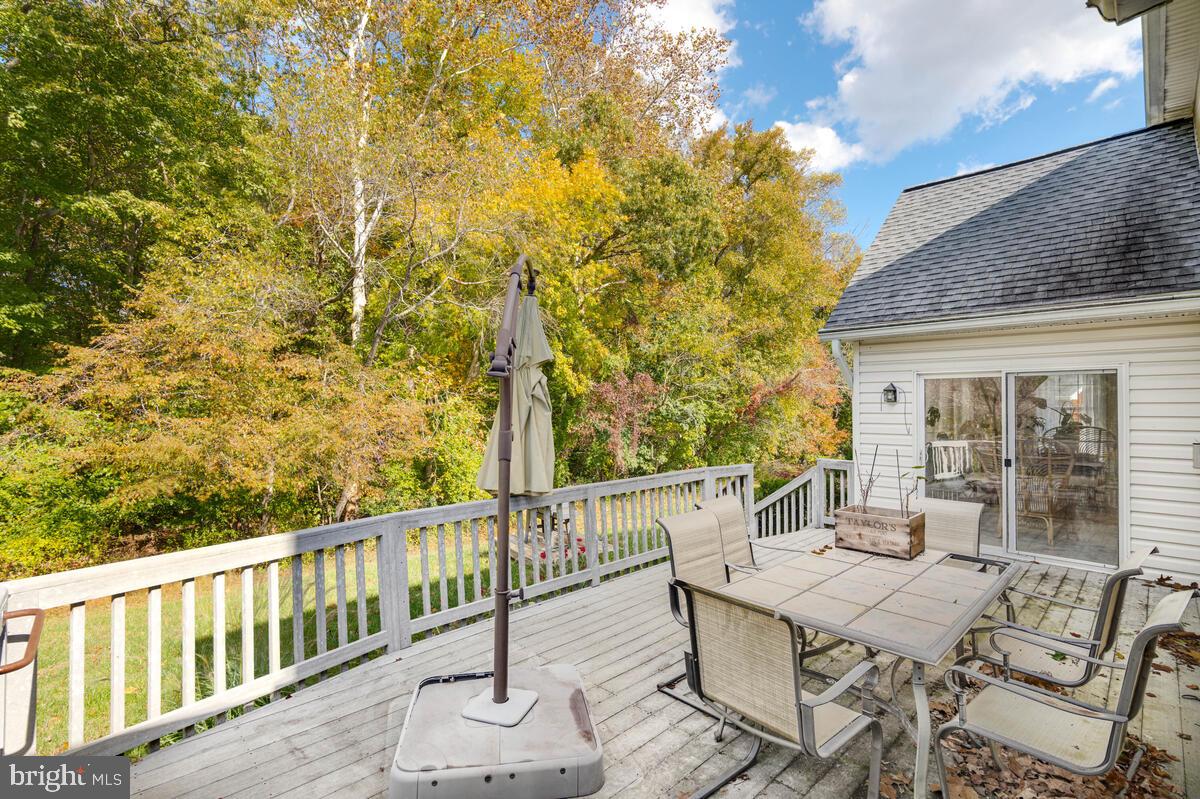 215 Hoile Lane Huntingtown, MD 20639 - Photo 5 of 52 a view of a patio with a table and chairs