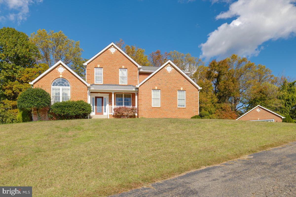 215 Hoile Lane Huntingtown, MD 20639 - Photo 52 of 52 a front view of a house with yard