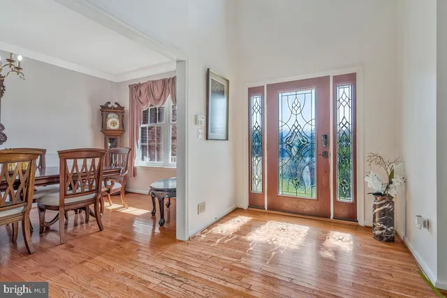 a view of a livingroom with furniture and hardwood floor