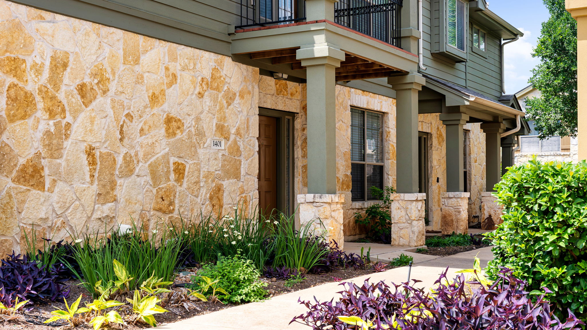 14815 Avery Ranch Boulevard, Unit 1401 Austin, TX 78717 - Photo 24 of 38 Exterior facade featuring varied natural stone cladding and green siding