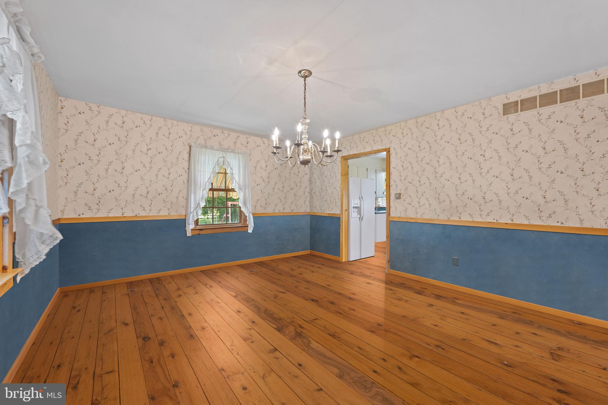 291 Acton Station Road Salem, NJ 08079 - Photo 25 of 45 a view of an empty room with window and wooden floor