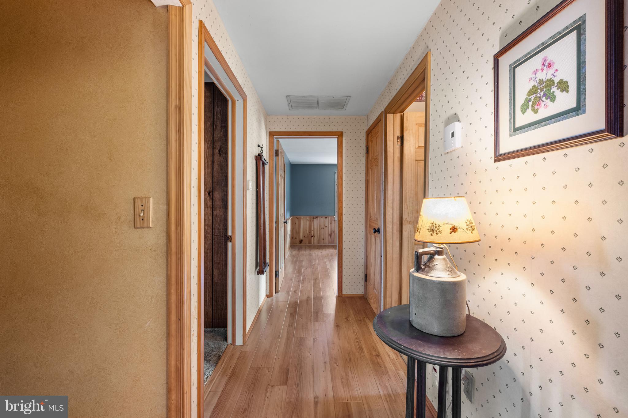 291 Acton Station Road Salem, NJ 08079 - Photo 26 of 45 a view of a hallway with wooden floor and a bathroom