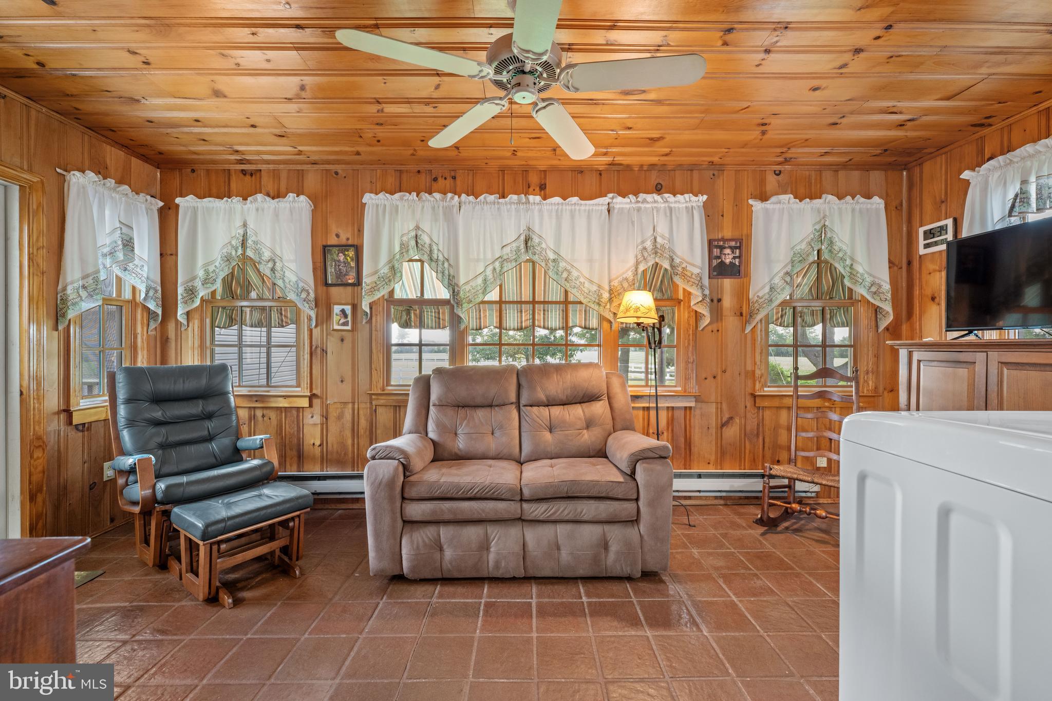 291 Acton Station Road Salem, NJ 08079 - Photo 30 of 45 a living room with furniture a flat screen tv and a table