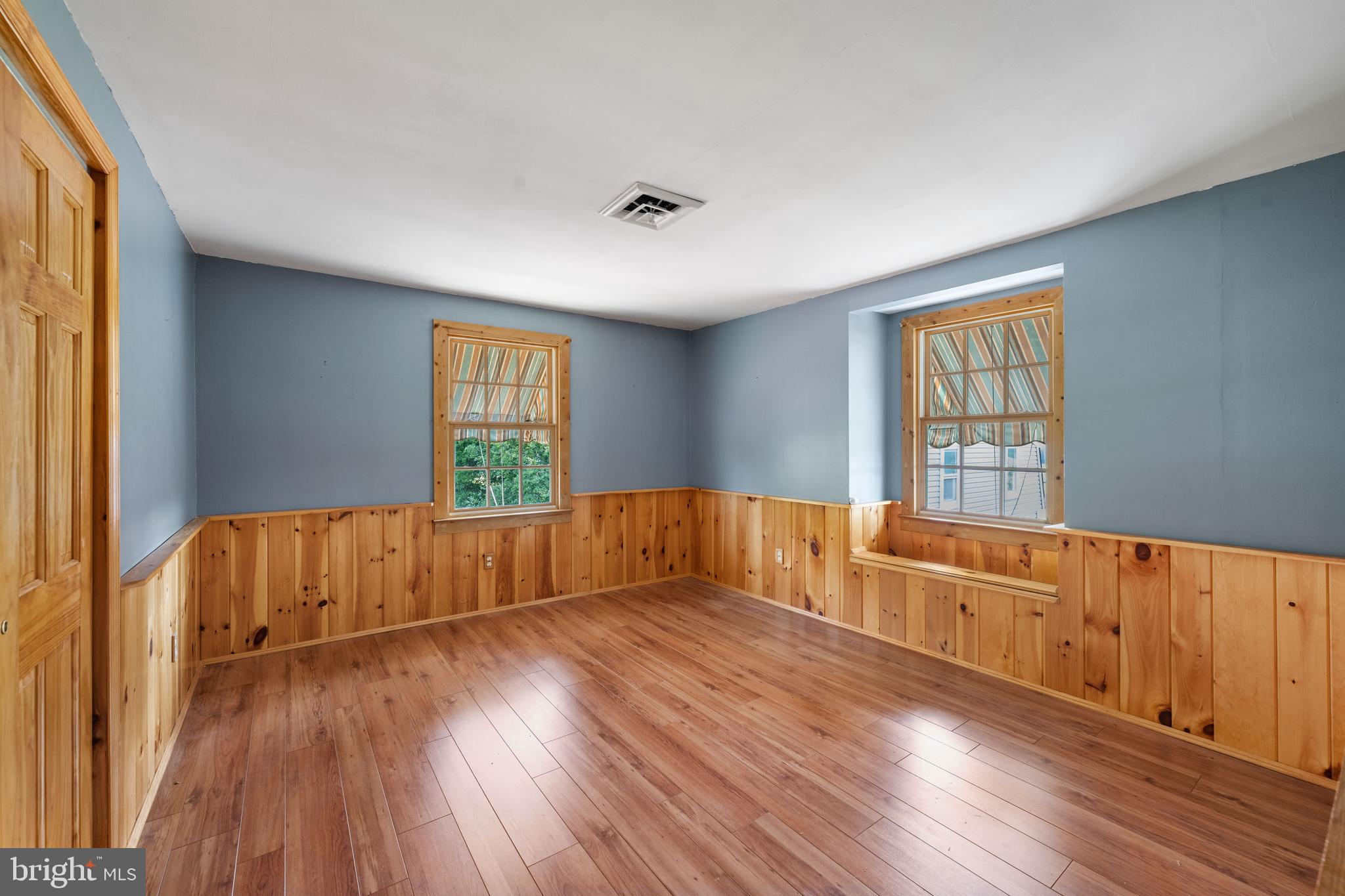 291 Acton Station Road Salem, NJ 08079 - Photo 33 of 45 an empty room with wooden floor and windows