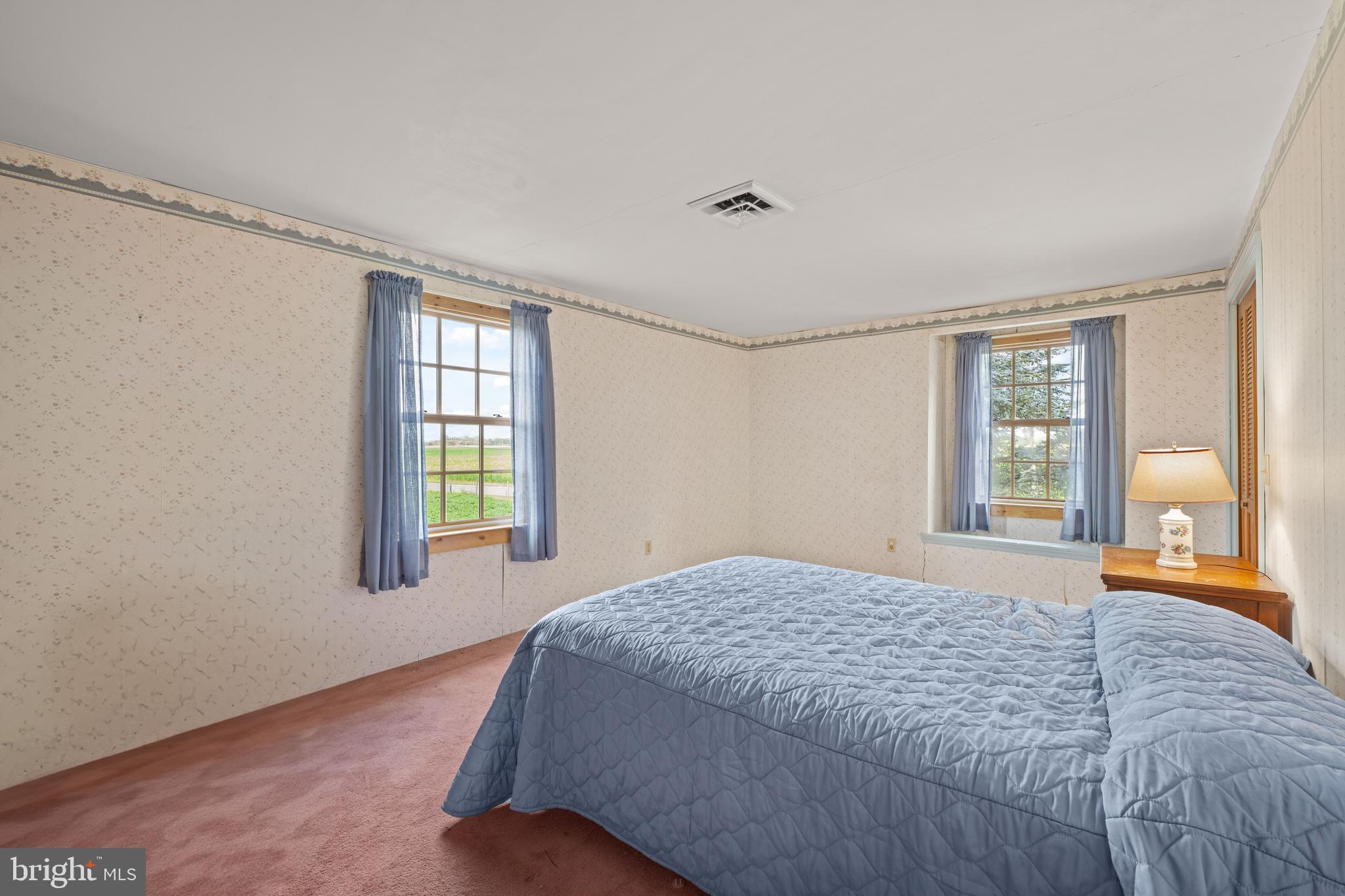 291 Acton Station Road Salem, NJ 08079 - Photo 39 of 45 a bedroom with a bed and a large window