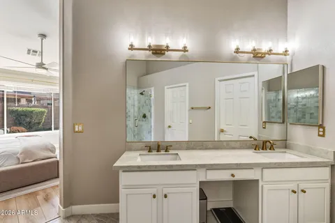 a bathroom with a sink and a mirror