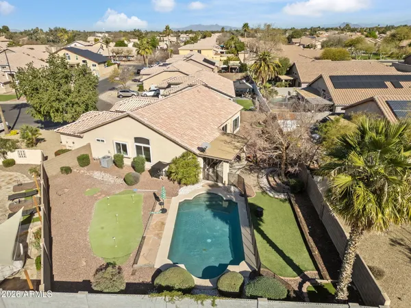 an aerial view of a residential houses with outdoor space