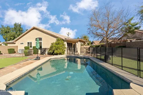 a front view of a house with swimming pool