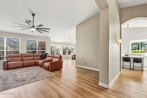a living room with furniture and a large window