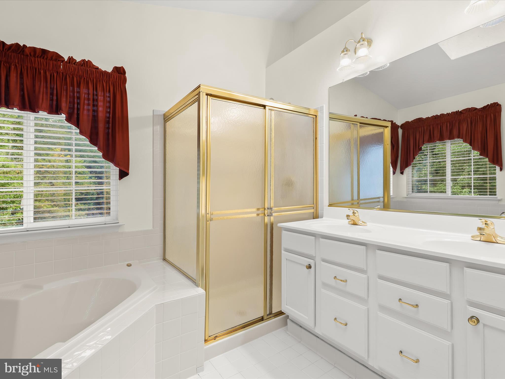 2614 Streamview Drive Odenton, MD 21113 - Photo 20 of 52 a bathroom with a tub sink and mirror