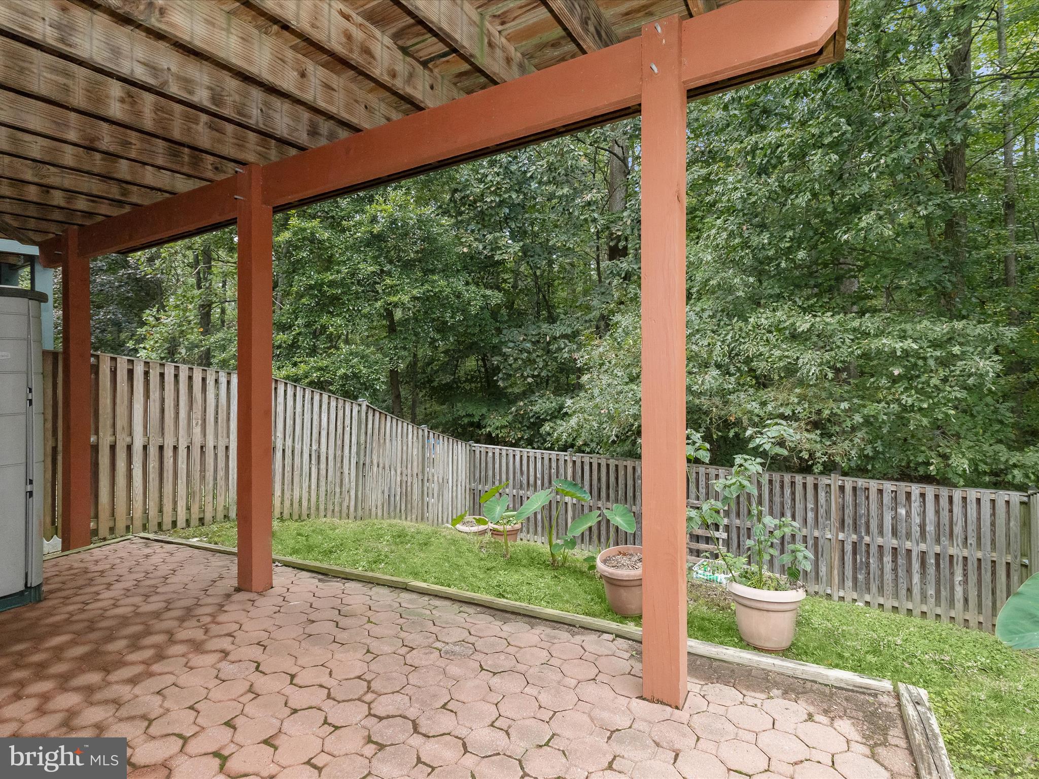 2614 Streamview Drive Odenton, MD 21113 - Photo 33 of 52 a porch with a bench in front of a house