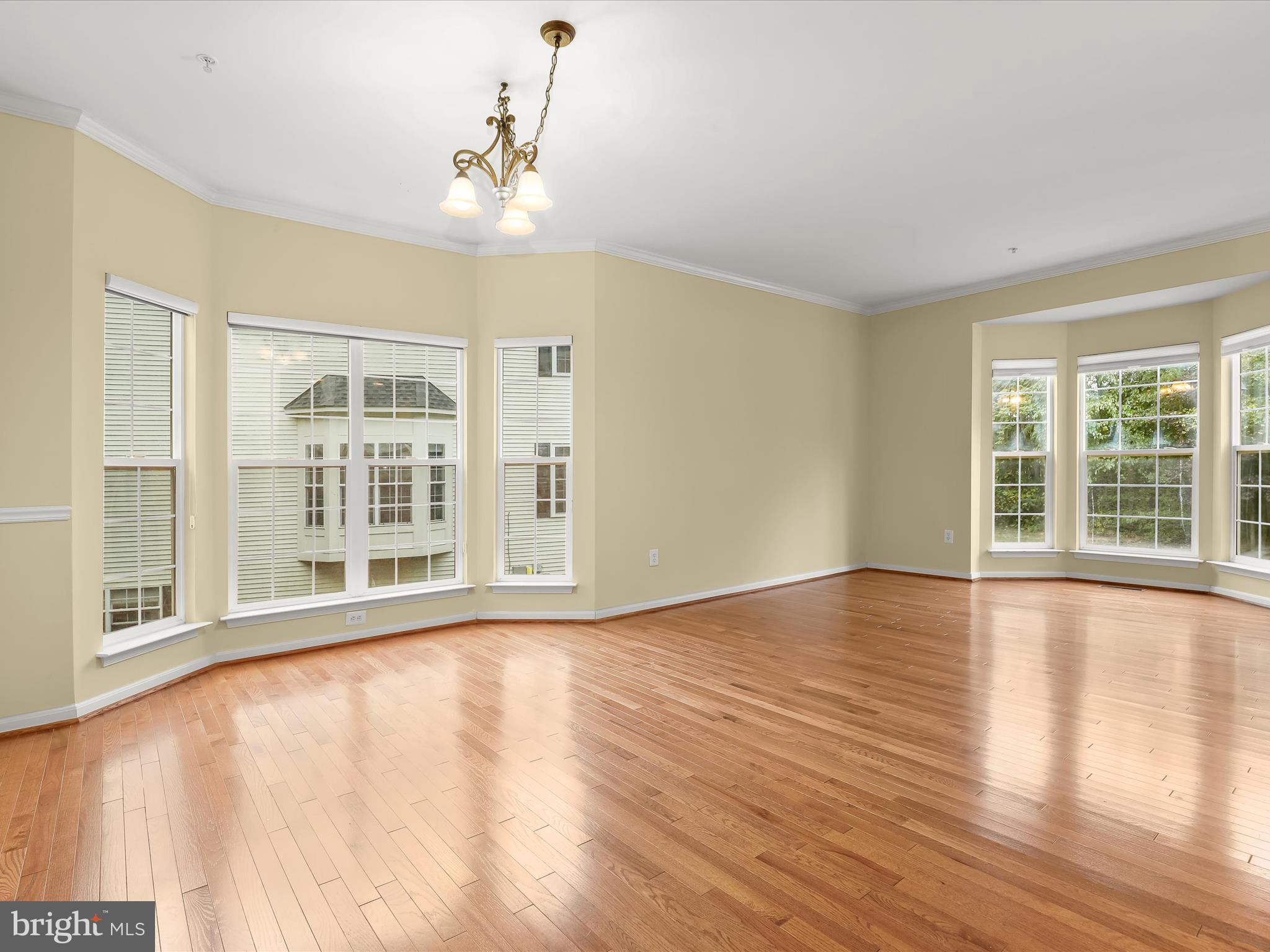2614 Streamview Drive Odenton, MD 21113 - Photo 4 of 52 a view of an empty room with wooden floor and a window