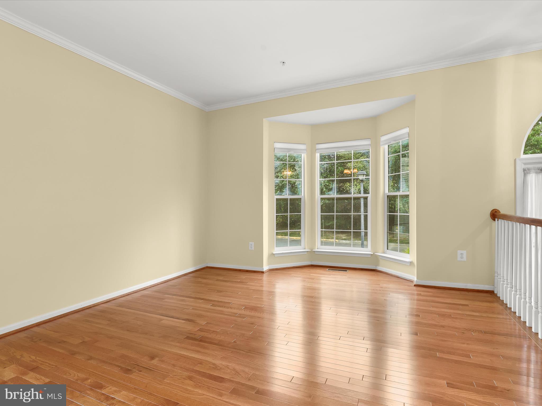 2614 Streamview Drive Odenton, MD 21113 - Photo 5 of 52 a view of an empty room with wooden floor and a window