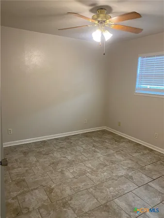 en empty room with windows