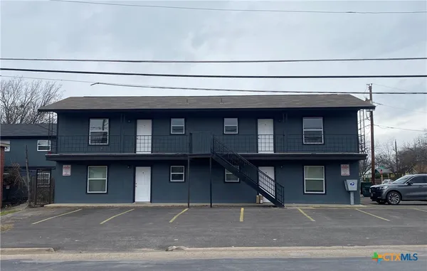a front view of a building with garage