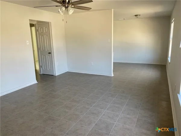 an empty room with a mirror