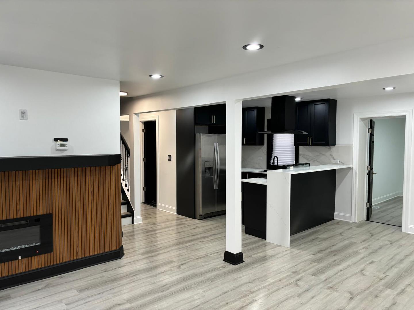 14609 Justine Street Harvey, IL 60426 - Photo 13 of 33 a kitchen with stainless steel appliances kitchen island granite countertop a refrigerator and a stove top oven