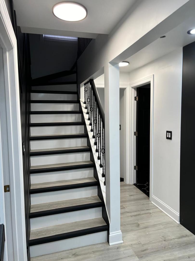 14609 Justine Street Harvey, IL 60426 - Photo 14 of 33 a view of entryway with wooden floor and stairs