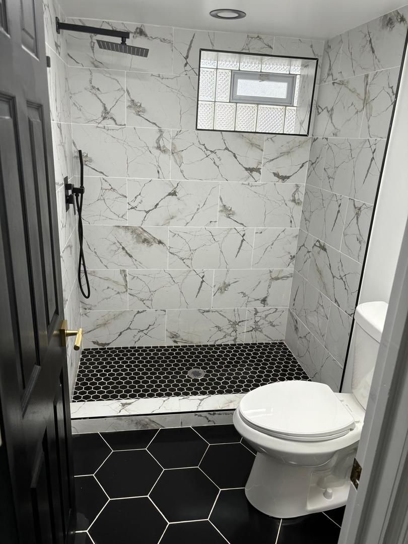 14609 Justine Street Harvey, IL 60426 - Photo 21 of 33 a bathroom with a toilet and a shower