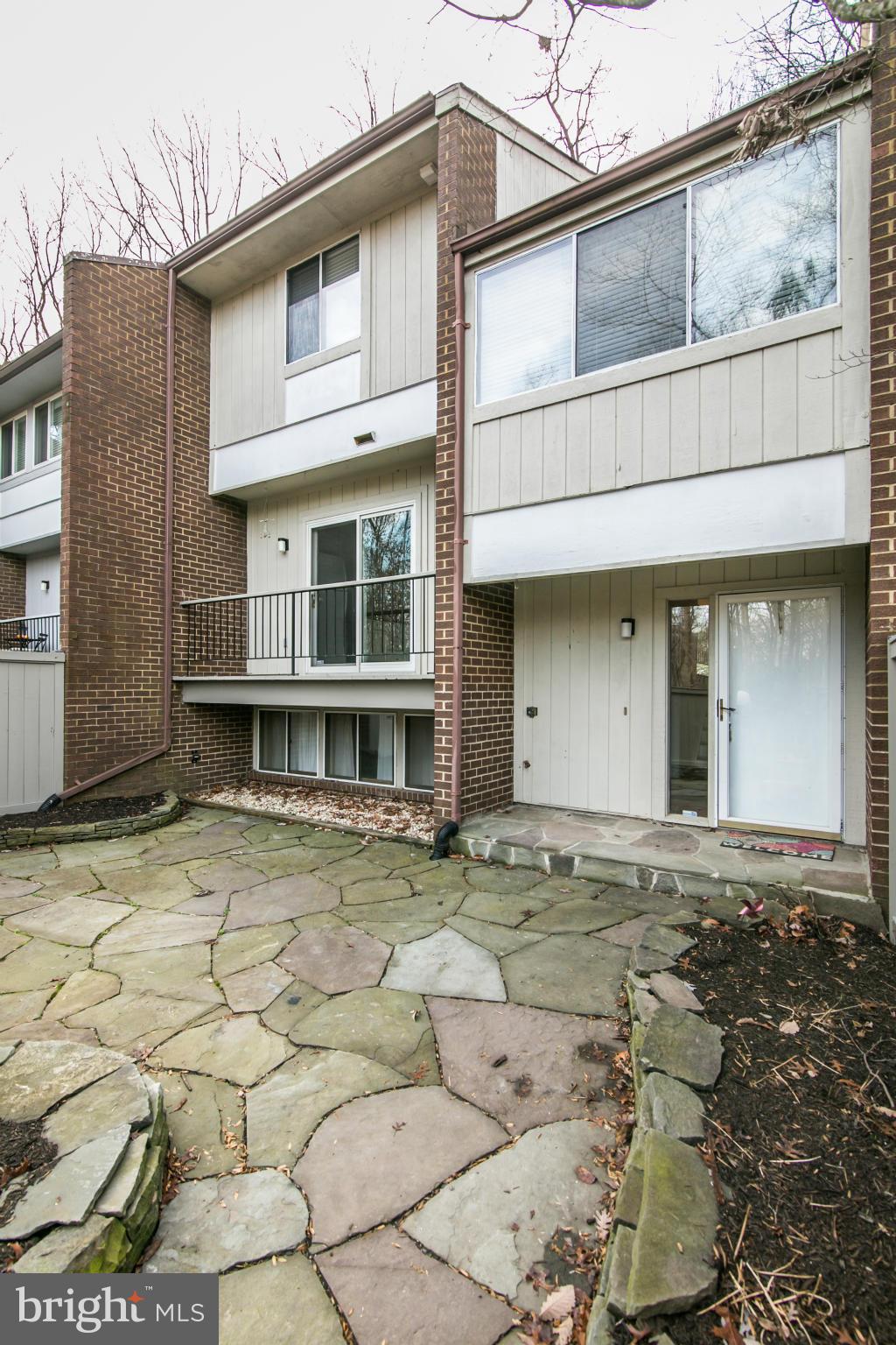 12017 Insha Court Reston, VA 20191 - Photo 2 of 30 A stone patio leads you to the front of the home.