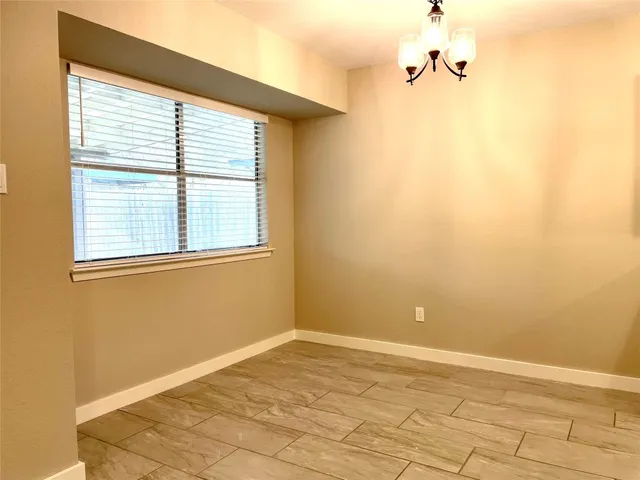 a kitchen with granite countertop cabinets and refrigerator