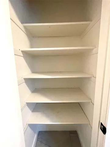 a view of a house with backyard and a tree