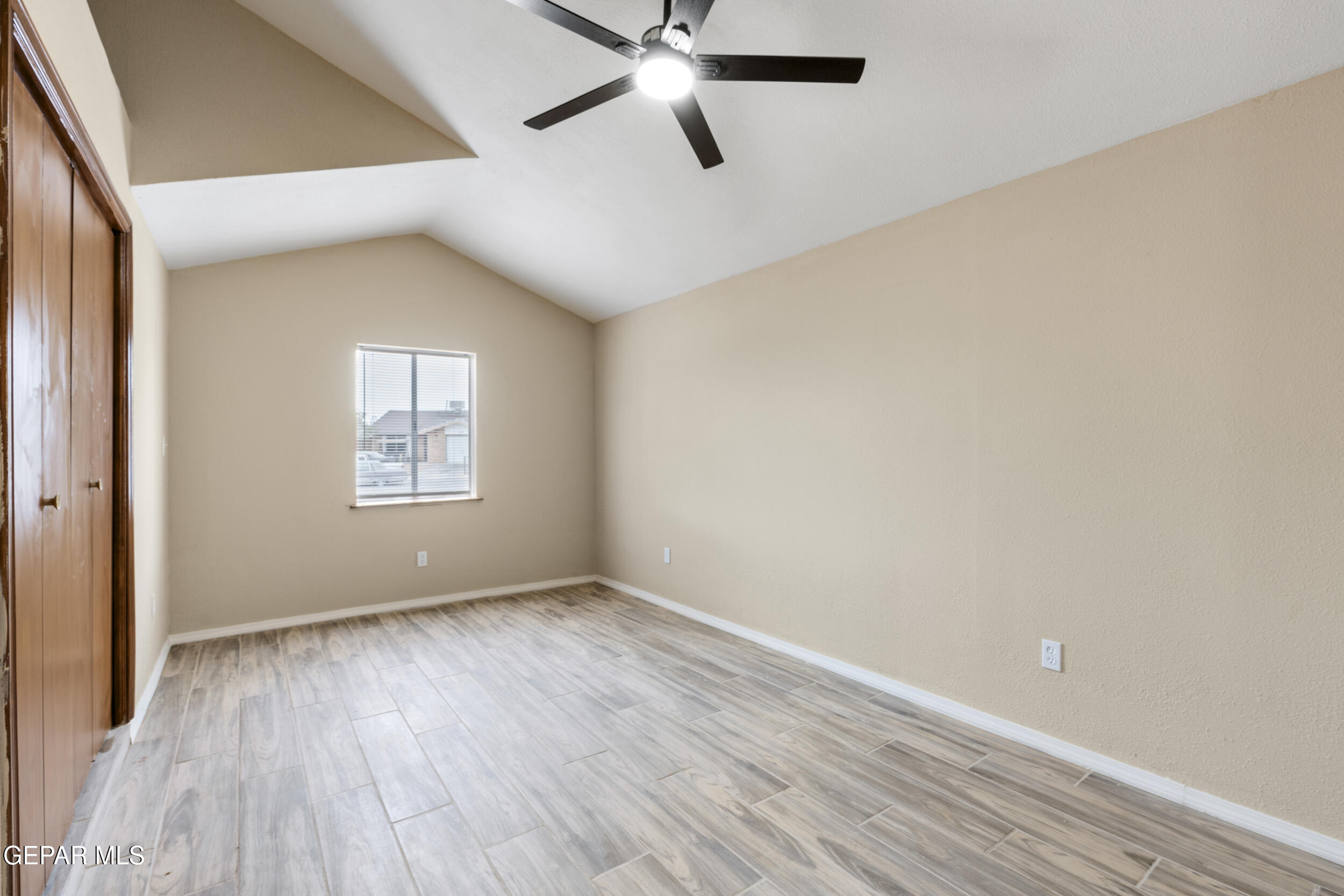 6708 Stone Court El Paso, TX 79924 - Photo 16 of 22 wooden floor in an empty room with a window