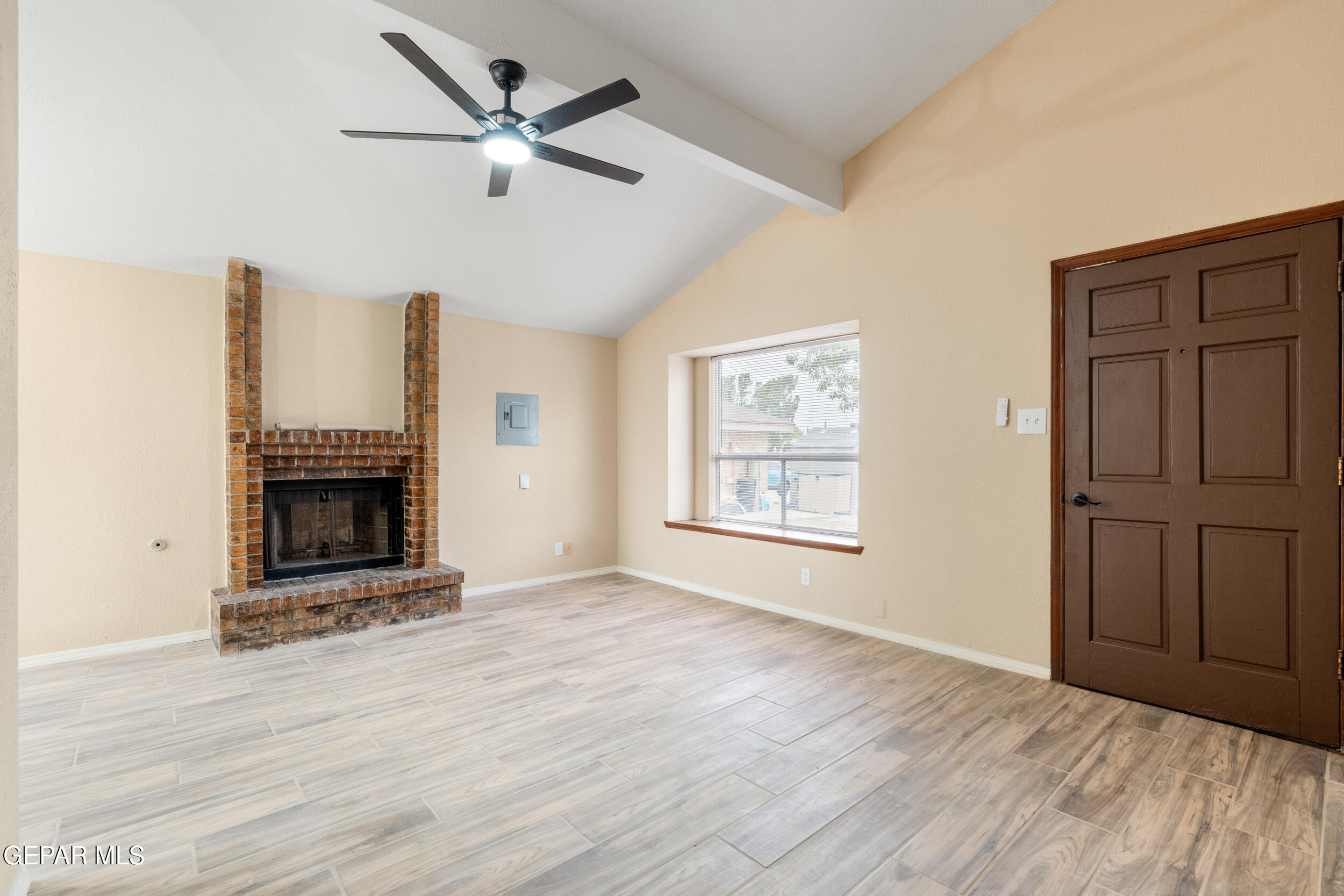 6708 Stone Court El Paso, TX 79924 - Photo 5 of 22 a view of an empty room with a fireplace and a window