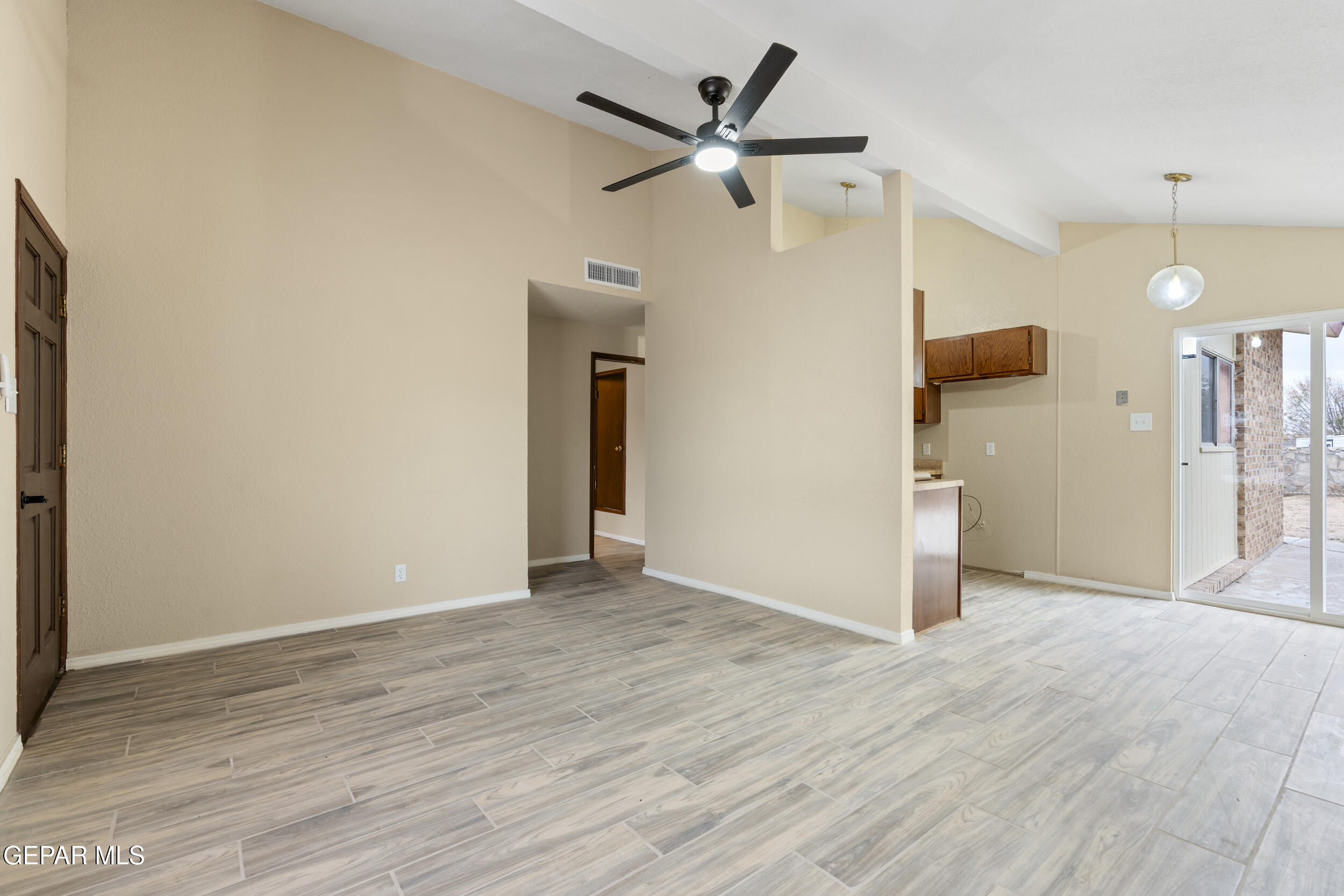 6708 Stone Court El Paso, TX 79924 - Photo 6 of 22 a view of a livingroom with a ceiling fan wooden floor and a ceiling fan