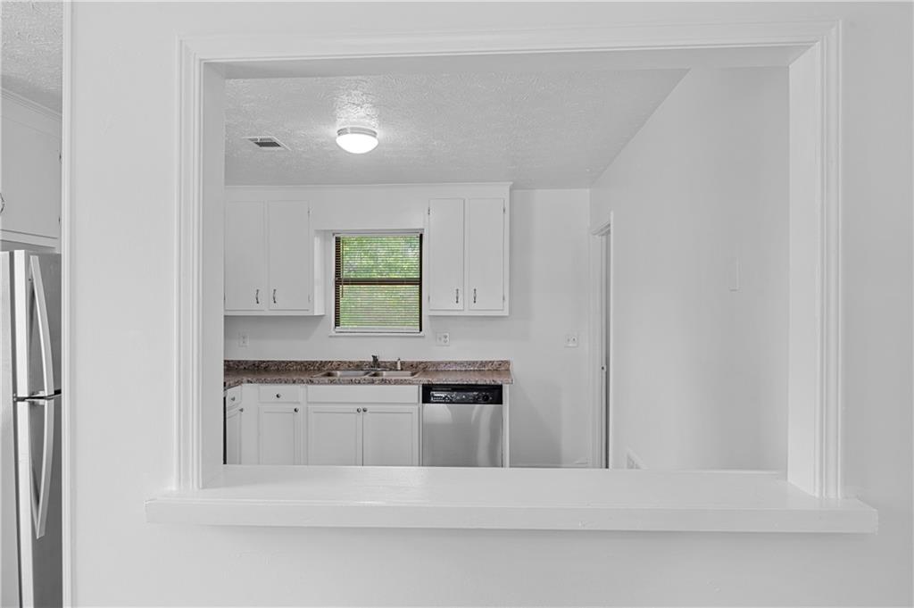 340 Tanglewood Drive, Unit A Monroe, GA 30656 - Photo 6 of 17 a view of a kitchen with a sink