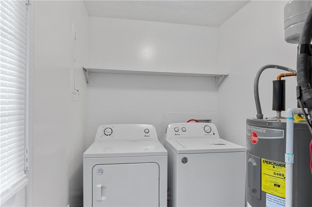 340 Tanglewood Drive, Unit A Monroe, GA 30656 - Photo 10 of 17 a utility room with dryer and washer
