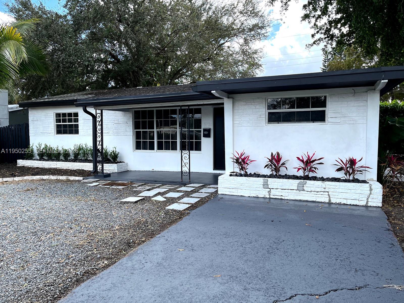 a front view of a house with garage