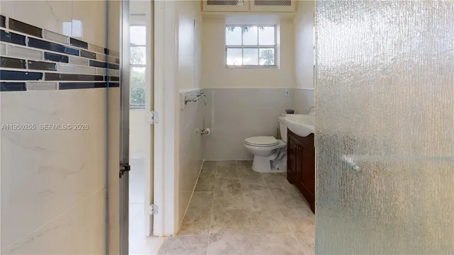 a bathroom with a sink and shower