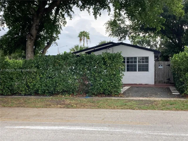 a view of a bench in a backyard
