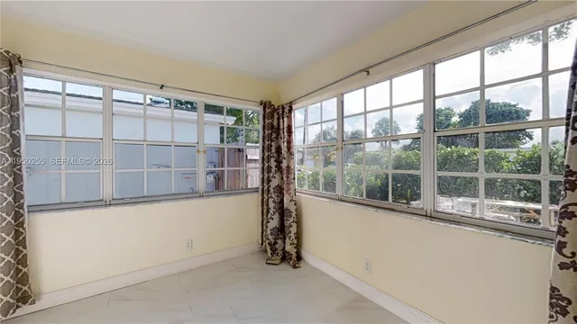 a bathroom with a sink toilet and mirror