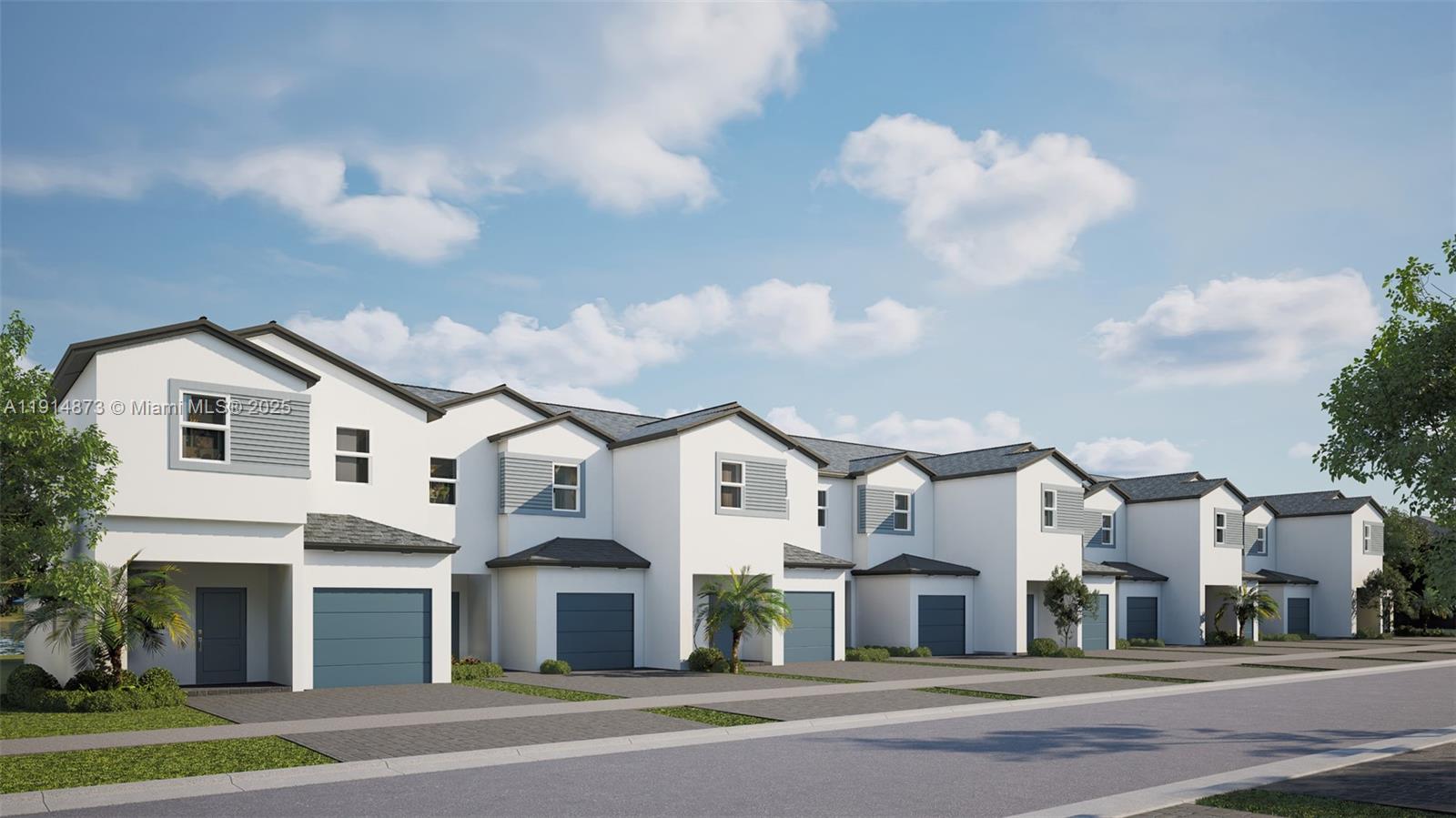 a view of a white house with a more windows and a small yard