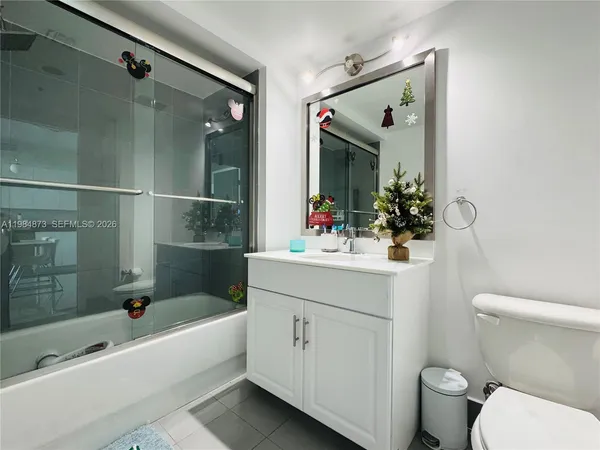 a bathroom with a bathtub and a sink