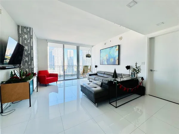 a living room with furniture fireplace and flat screen tv