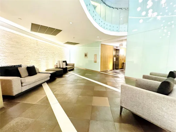 a backyard of a house with garden and outdoor seating