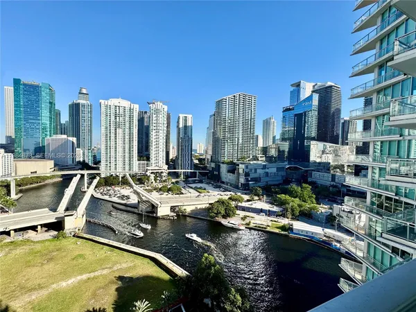 a view of a chairs and table in the backyard