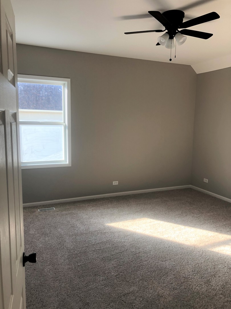 13315 Blakely Drive Plainfield, IL 60585 - Photo 13 of 20 en empty room with windows